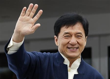 Jackie Chan is seen waving his hand to his fans.