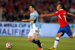 Chile's Gary Medel (R) tries to stop Argentina's Lionel Messi during a World Cup qualifying match in 2012.