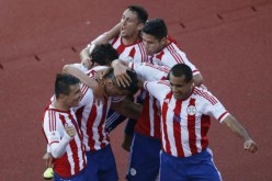 Paraguay's Lucas Barrios (8) celebrates with teammates after scoring a goal against Uruguay during the first round of Copa America 2015.
