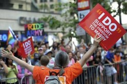 A same-sex marriage supporter waves an LGBT sign at the 41st LGBT Pride parade in San Francisco on June 26, 2011.