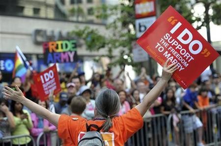 A same-sex marriage supporter waves an LGBT sign at the 41st LGBT Pride parade in San Francisco on June 26, 2011.