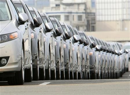 Newly produced cars are parked at a port in Yokohama, south of Tokyo, April 1, 2010.