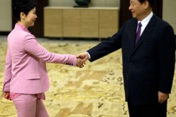 Chinese President Xi Jinping shakes hands with Li Xiaolin, chairman of China Power International Development Ltd., daughter of former premier Li Peng, during the Boao Forum in 2013.