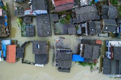 Houses flooded in Chejiu village of Yuyao, east China's Zhejiang Province. China's meteorological authority on Sunday downgraded the alert for Typhoon Chan-Hom from red to orange as it is set to weaken on its way to move northeast. 