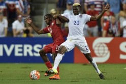 USA forward Gyasi Zardes (20) battles for the ball with Panama player Armardo Cooper (11).