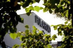 The world headquarters of Polaroid Corporation is framed by trees inCambridge, Massachusetts October 10, 2001.