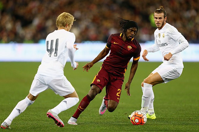 Real's Martin Ødegaard (#41) and Gareth Bale tries to stop Gervinho of AS Roma during their ICC friendly match in Melbourne.