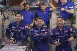 All six Expedition 44 crew members gathered inside the Zvezda service module for a crew greeting ceremony with new crewmates (front row from left) Kimiya Yui, Oleg Kononenko and Kjell Lindgren. In the back from left are Mikhail Kornienko, Gennady Padalka 