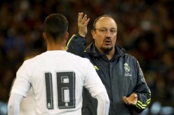 Real Madrid manager Rafa Benitez (R) talks to Lucas Vazquez in a 2015 ICC match against Roma in Melbourne