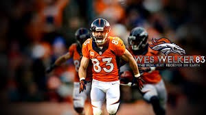 Dec 8, 2013; Denver, CO, USA; Denver Broncos wide receiver Wes Welker (83) celebrates after scoring a touchdown during the first half against the Tennessee Titans at Sports Authority Field at Mile High. 