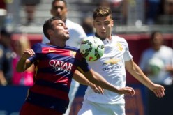 Barcelona's Rafinha (L) in action with Manchester United's Andreas Pereira.