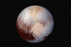 This NASA's photo of Pluto was made from four images from New Horizons' Long Range Reconnaissance Imager (LORRI) combined with color data from the Ralph instrument in this enhanced color global view.