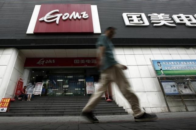 A man walks past a GOME store in Shanghai, Aug. 26, 2013.