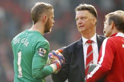 Manchester United manager Louis van Gaal shakes the hand of goalkeeper David de Gea.
