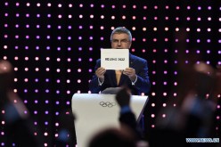 President of the International Olympic Committee (IOC) Thomas Bach announces that Beijing won the bid to host the 2022 Olympic Winter Games at the 128th International Olympic Committee session in Kuala Lumpur, Malaysia, July 31, 2015. 