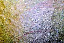 Unusual arc-shaped, reddish streaks cut across the surface of Saturn's ice-rich moon Tethys in this enhanced-color mosaic. The red streaks are among the most unusual color features on Saturn's moons to be revealed by Cassini's cameras.