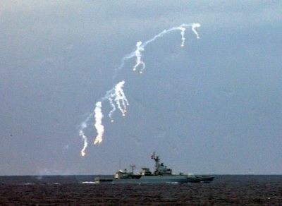 A PLA warship launches missiles during a live-ammunition military drill in the South China Sea, Hainan Province, on July 26, 2010.