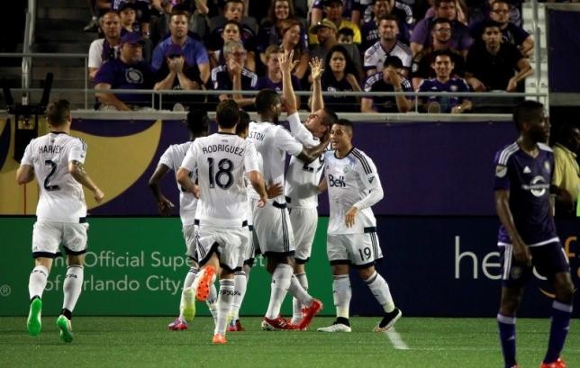 Vancouver FC forward Octavio Rivero (29) is congratulated by teammates after he made the game winning goal during the second half at Orlando Citrus Bowl. 