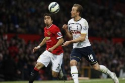 Manchester United's Rafael da Silva (L) in action with Tottenham Hotspur's Harry Kane last season.