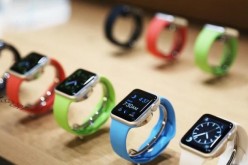 Photos of Apple Watch with different band colors.