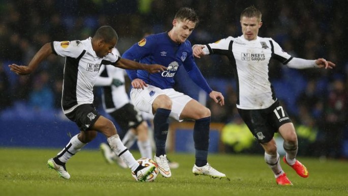 Everton's Conor McAleny (center) is challenged by FC Krasnodar players.