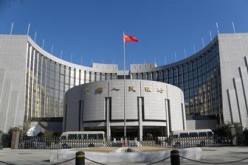 China's central bank has started to implement financial reforms that included a new exchange rate system.