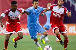 New England Revolution's London Woodberry (L) and Lee Nguyen defend against NYCFC's David Villa.