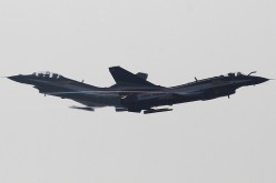 Two J-10 fighter jets from the People’s Liberation Army Air Force fly in formation above the skies of Zhuhai, Guangdong Province, on Nov. 13, 2012. 
