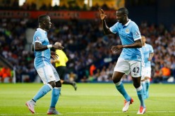 Manchester City's Yaya Touré (R) celebrates his goal against West Brom.