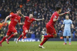 Liverpool's Philippe Coutinho (R) celebrates after scoring a goal for his side.