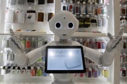 Taiwan's Asustek Computer is set to release its humanoid in 2016, similar to SoftBank's Pepper, shown here displayed in a store in Tokyo last year.