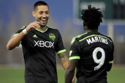 Seattle Sounders' Clint Dempsey (L) and Obafemi Martins.