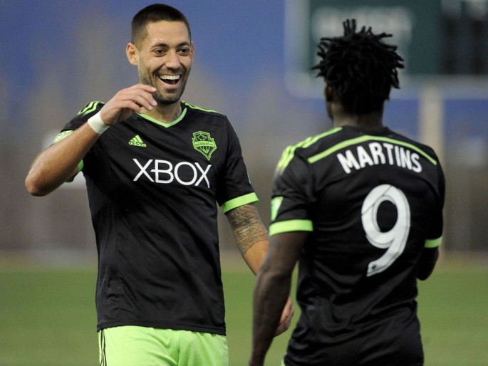 Seattle Sounders' Clint Dempsey (L) and Obafemi Martins.