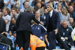 Chelsea manager Jose Mourinho (L) shakes hands with Manchester City manager Manuel Pellegrini after the 3-0 blowout game. 
