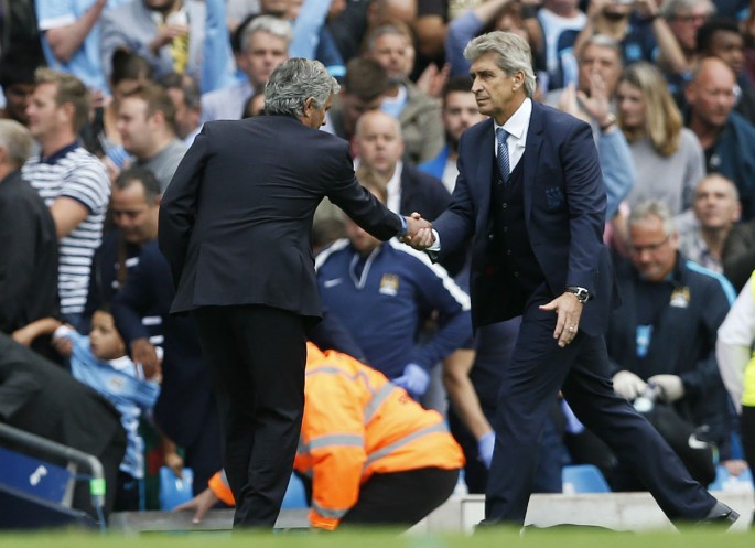 Chelsea manager Jose Mourinho (L) shakes hands with Manchester City manager Manuel Pellegrini after the 3-0 blowout game. 