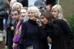 Britain's Camilla, Duchess of Cornwall (3rd R) speaks to cast member Shobna Gulati during a visit to the television set of 