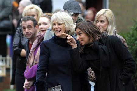 Britain's Camilla, Duchess of Cornwall (3rd R) speaks to cast member Shobna Gulati during a visit to the television set of "Coronation Street" in Manchester, northern England February 4, 2010.