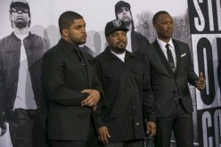 Corey Hawkins (R), who portrays Dr. Dre, and O'Shea Jackson Jr. (L), who portrays Ice Cube, pose with producer Ice Cube at the premiere of ''Straight Outta Compton'' in Los Angeles, California August 10, 2015.