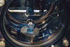 The vacuum chamber of the atom interferometer contains a one-inch diameter aluminum sphere. If chameleons exist, cesium atoms would fall toward the sphere with a slightly greater acceleration than their gravitational attraction would predict.