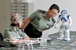 Chinese scientists have develop a mind-controlled robotic suit.