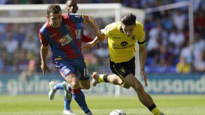 Aston Villa's Jack Grealish (R) in action against Crystal Palace's James McArthur.