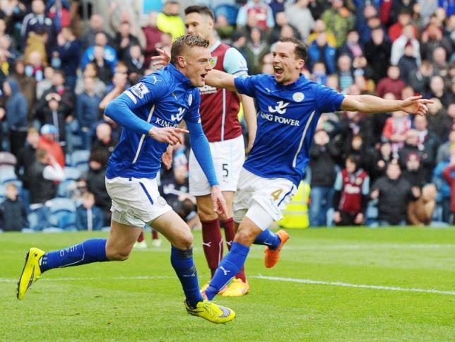 Leicester City forward Jamie Vardy (L) celebrates with a teammate after scoring a goal.