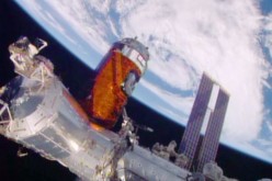 Japan’s “Kounotori” resupply ship is installed to the Harmony module. 