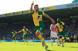 Norwich City defender Russell Martin celebrates his goal against Stoke City.