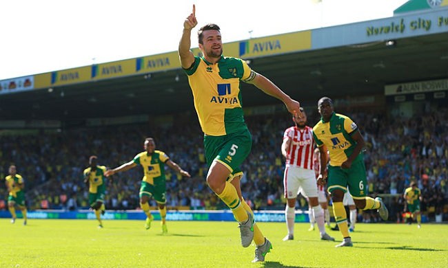 Norwich City defender Russell Martin celebrates his goal against Stoke City.