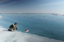Laurence C. Smith, Chair of Geography at University of California, Los Angeles, deployed an autonomous drifter in a meltwater river on the surface of the Greenland ice sheet on July 19, 2015. 