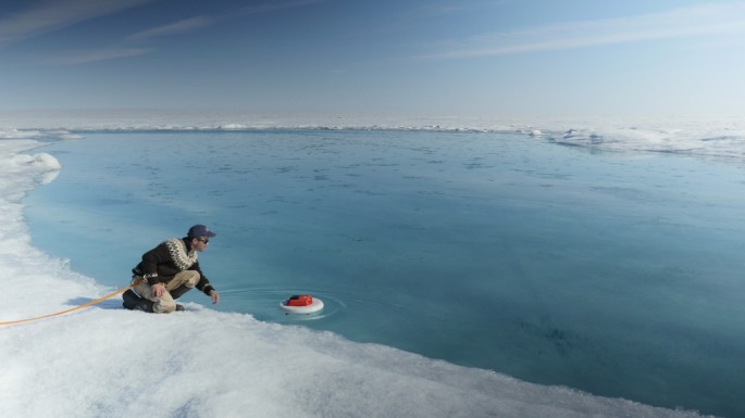 Laurence C. Smith, Chair of Geography at University of California, Los Angeles, deployed an autonomous drifter in a meltwater river on the surface of the Greenland ice sheet on July 19, 2015. 