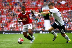 Manchester United newly-signed striker Memphis Depay (L) against Tottenham Hotspur defender Ben Davies