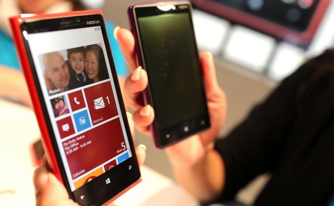 The new Nokia Lumia 920 (L) and 820 Windows smartphones are displayed during a joint event with Microsoft.