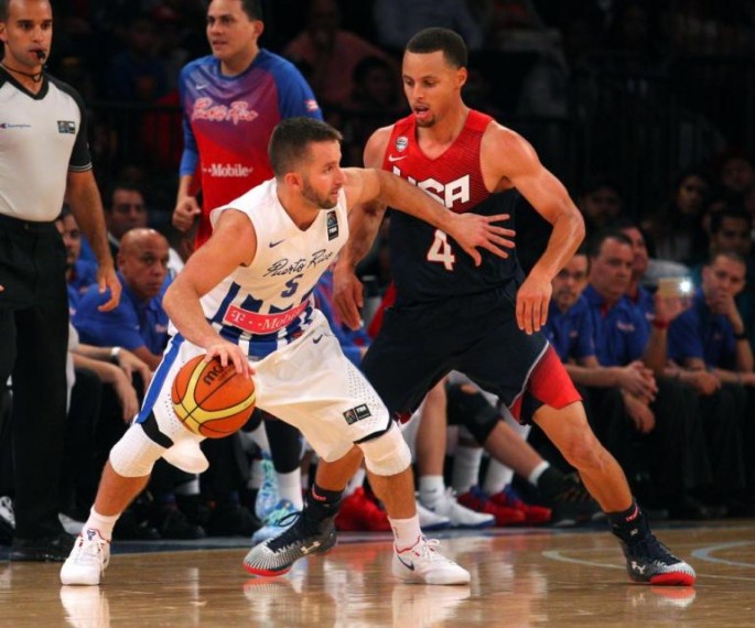 Puerto Rico's J.J. Barea (L) posting up against Team USA's Steph Curry.